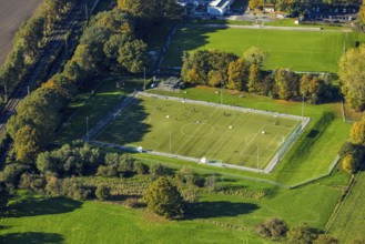 Aerial view, soccer stadium sports ground TuS 1910 Wiesergofen, surrounded by autumn trees, young
