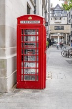 London, United Kingdom - 15 May 2025: Classic british symbol: a weathered red telephone box