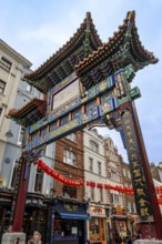 London, United Kingdom - 15 May 2025: Ornate and colorful traditional chinese gate marking the