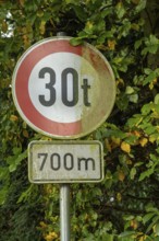 Raesfeld, NRW, Germany, Old traffic sign indicating a 30-ton weight limit ahead for 700 meters