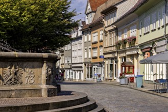 Historic street with facades and a fountain on the cobblestones, The old town of Arnstadt in