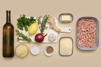 Ingredients for making risoni pasta with shrimp including white wine, parsley, lemon, thyme,