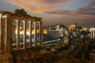 Night view photo at dusk evening view of Roman Forum, left column ruin remains of Temple of Saturn,