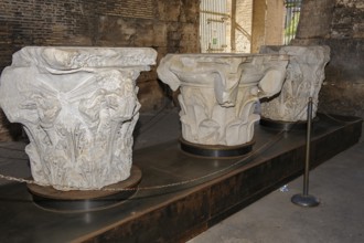 Ancient eroded column capitals exhibited in the Colosseum Corinthian capital, Rome, Lazio, Italy