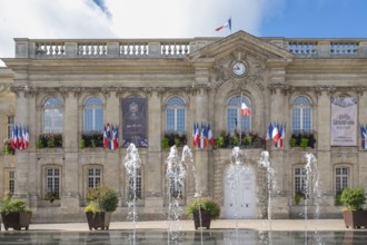 The classicist façade of Beauvais Town Hall (Hotel de Ville) dominates Place Jeanne Hachette. Floor