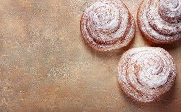 Bakery product, lemon twist, with white glaze, sweet bun, muffin, pastries, top view, no people