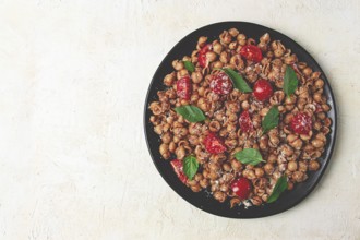 Tuscan pasta with smoked paprika and basil, parmesan cheese, Italian traditional cuisine