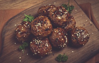 Tsukune, Japanese meatballs, minced chicken, fried on a skewer, with yakitori sauce, homemade, no