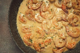 Shrimp in creamy garlic sauce, with spices and herbs