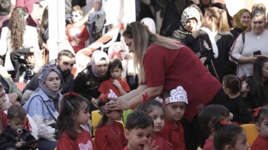 Children celebrate the 102nd anniversary of the Republic Day of Turkey, a national holiday