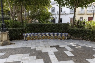 Beautiful natural park with a bunch of tiled park bench, The Ornamental Pond in Genovés Botanic