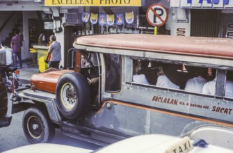 Jeepney, minibus in heavy traffic with nuns as passengers, Manila in 1995, Philippines