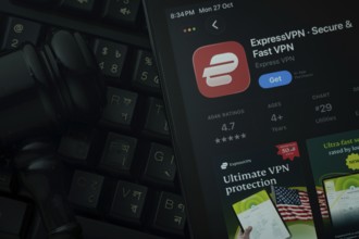 Dhaka, Bangladesh- 28 Oct 2025: An iPad displaying the ExpressVPN app against a judge's gavel and