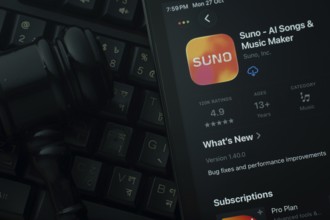 Dhaka, Bangladesh- 28 Oct 2025: An iPad displaying the Suno AI app against a judge's gavel and dark