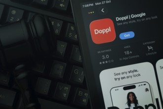 Dhaka, Bangladesh- 28 Oct 2025: An iPad displaying the Doppl app against a judge's gavel and dark