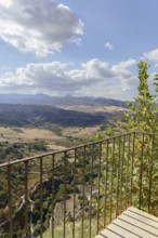 Ronda, malaga, spain Viewpoint balcony overlooking the vast valley with mountains and fields under