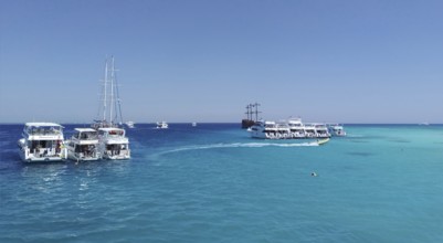 The snow-white yachts arrived as part of the Egyptian Maldives excursion tour, dropping off
