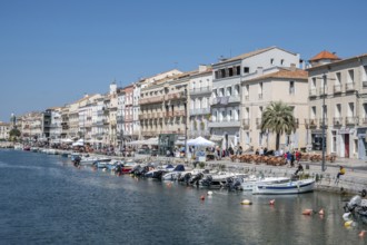 The lively promenade of Quai Leopold Suquet along the Canal de Sete, formerly Canal Royal, with a