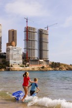 Swimming fun, beach, skyscraper skyline, construction sites, Mediterranean Sea, Benidorm, Valencia