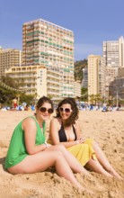 Two woman on the beach, Benidorm, Valencia (region), Costa Blanca, Spain