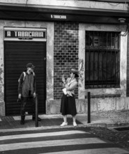 Black and white photography, street art, tourists in the Portuguese capital Lisbon, Portugal