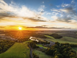 Sunset over Norham Castle and River Tweed from a drone, Norham, Northumberland, England, United
