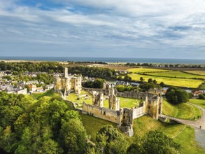 Warkworth Castle over River Coquet from a drone, Warkworth, Northumberland, England, United Kingdom