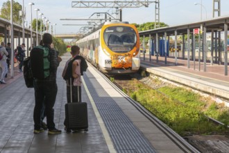 Renfe Civia commuter train at platform of Airport railway station, Rodalia de Barcelona suburban