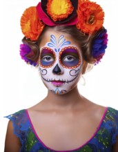 A young girl with traditional Day of the Dead face paint and a vibrant floral headpiece, wearing a