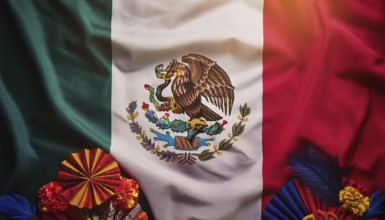 The Mexican flag displayed with festive paper decorations and marigold flowers, symbolizing Mexican