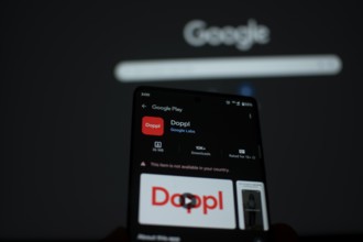 Smartphone showing Doppl app page on Google Play with Google in the background