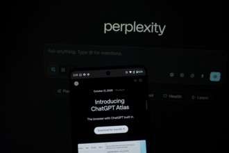 Smartphone screen with ChatGPT Atlas text against a background labeled perplexity