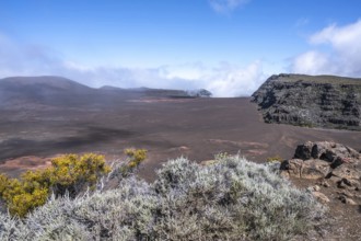 View from Pas de Bellecombe on the Route du Volcan of the Enclos Fouque caldera with rust-red