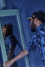 EDITORIAL and NEWS ONLY, celebrity and stand-up comedian Matt Okine looking at himself in mirror