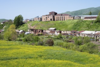 Rural village on green hills with scattered buildings and fields, Kechut, Kushchi, Kush-Bilyak,