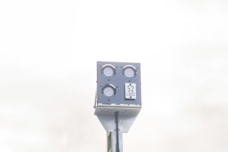 Metal pole with a camera or sensor against a bright sky, Signalbau an der Hermann Hessebahn, Calw,
