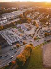 Aerial view of a city at sunset with autumn colors and a mountainous landscape, Calw, Black Forest,