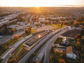 Bird's eye view of a village at sunset with Hermann Hessebahn rails in the foreground, Calw, Black