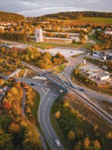 Aerial view of a bridge over Hermann Hesse railway tracks surrounded by autumnal landscapes, Calw,