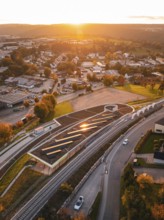 Aerial view of Hermann Hesse Bahn Heumaden station, at sunset with rails in the foreground, Calw,