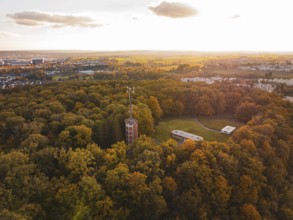 Water tower in autumn forest at sunset, Sindelfingen, Böblingen district, Germany