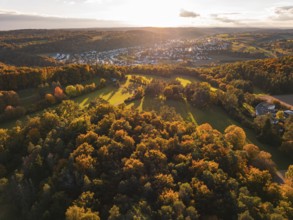 Dense forests and a wide view of a small town settlement in the distance, Aidlingen, Böblingen