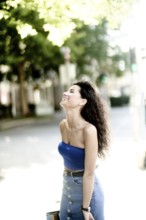 The laughing twisting itself away across body tension, giggle passes on as sweeping liveliness of