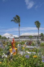 The flowery, multi-religious cemetery of Saint-Gilles-les-Hauts, with colorful graves and a Hindu