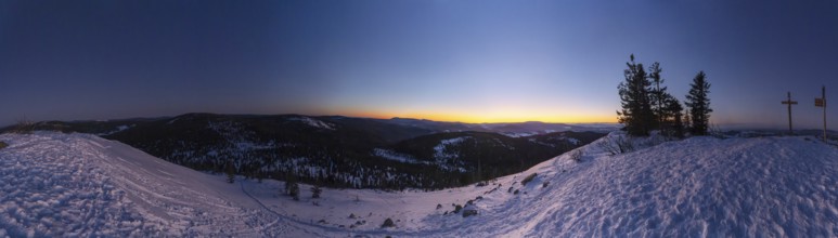 View from Mount Lusen over the hills of the bavarian forest at sunrise in winter, Bavaria, Germany