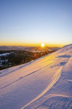 Sunrise over the hills of czech republic from Mount Lusen wth the view over the hills of the