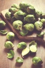 Fresh Brussels sprouts, raw, top view, on a wooden table, no people
