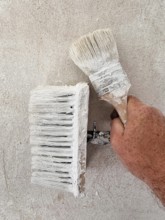 Renovation. Walls are designed with a tassel and brush. Horn-Bad Meinberg, North Rhine-Westphalia,