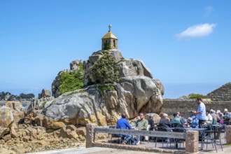 The small stone chapel of Saint-Gildas is perched on a distinctive rock of pink granite, while in