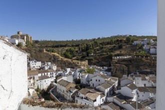 On the road to the white villages. Panorama or skyline of a historic old town with many white